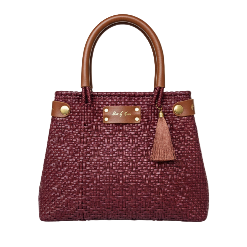 Red handbag with wooden handle and gold accents on a white background