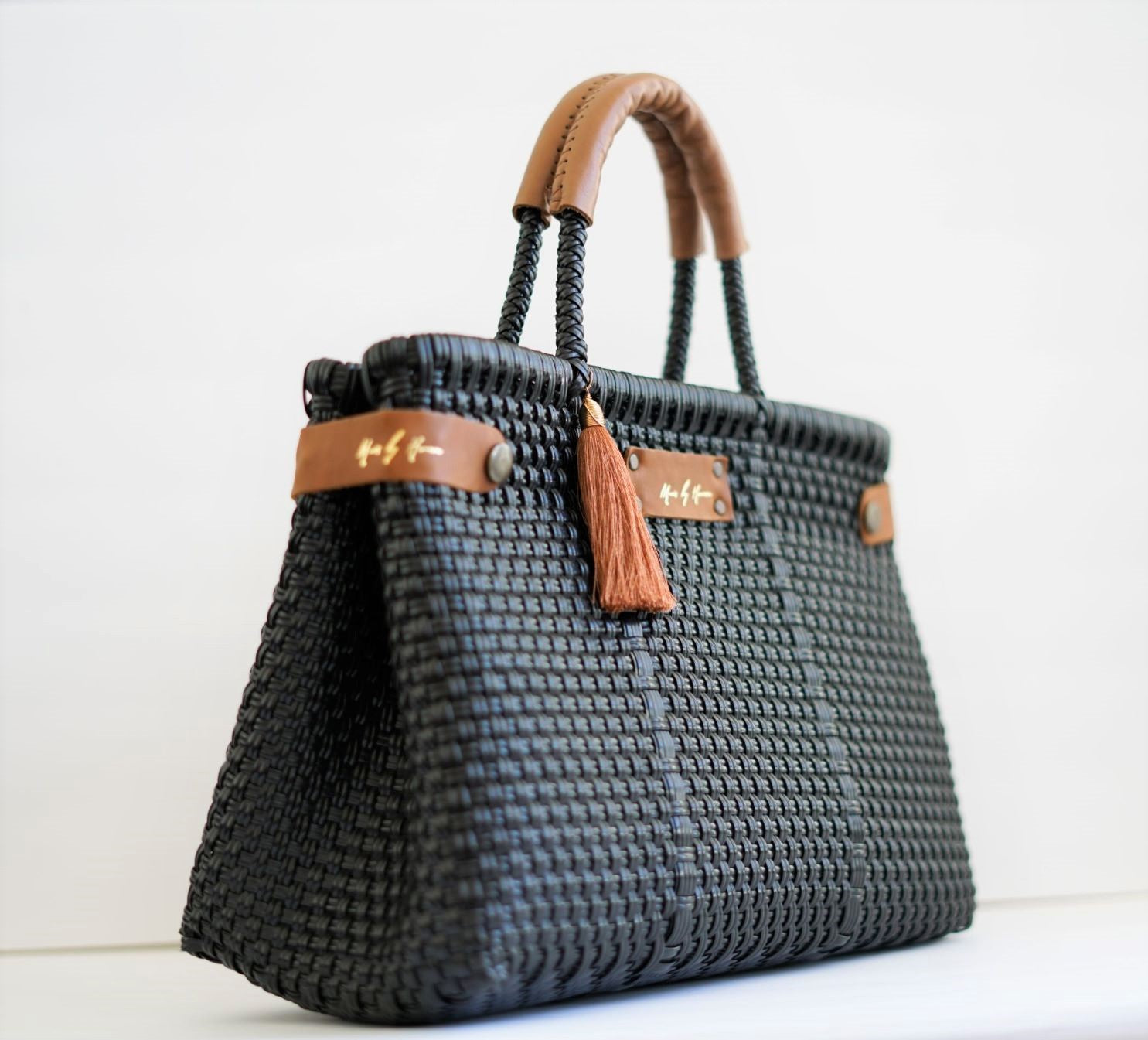 Black Less Pollution convertible bag in its structured handbag style