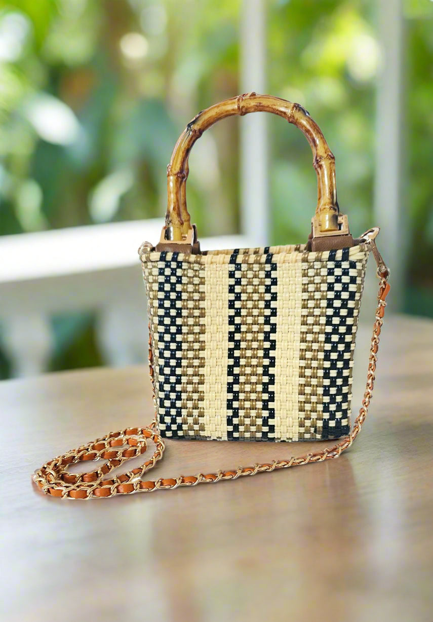 Woven handbag with bamboo handle and chain strap