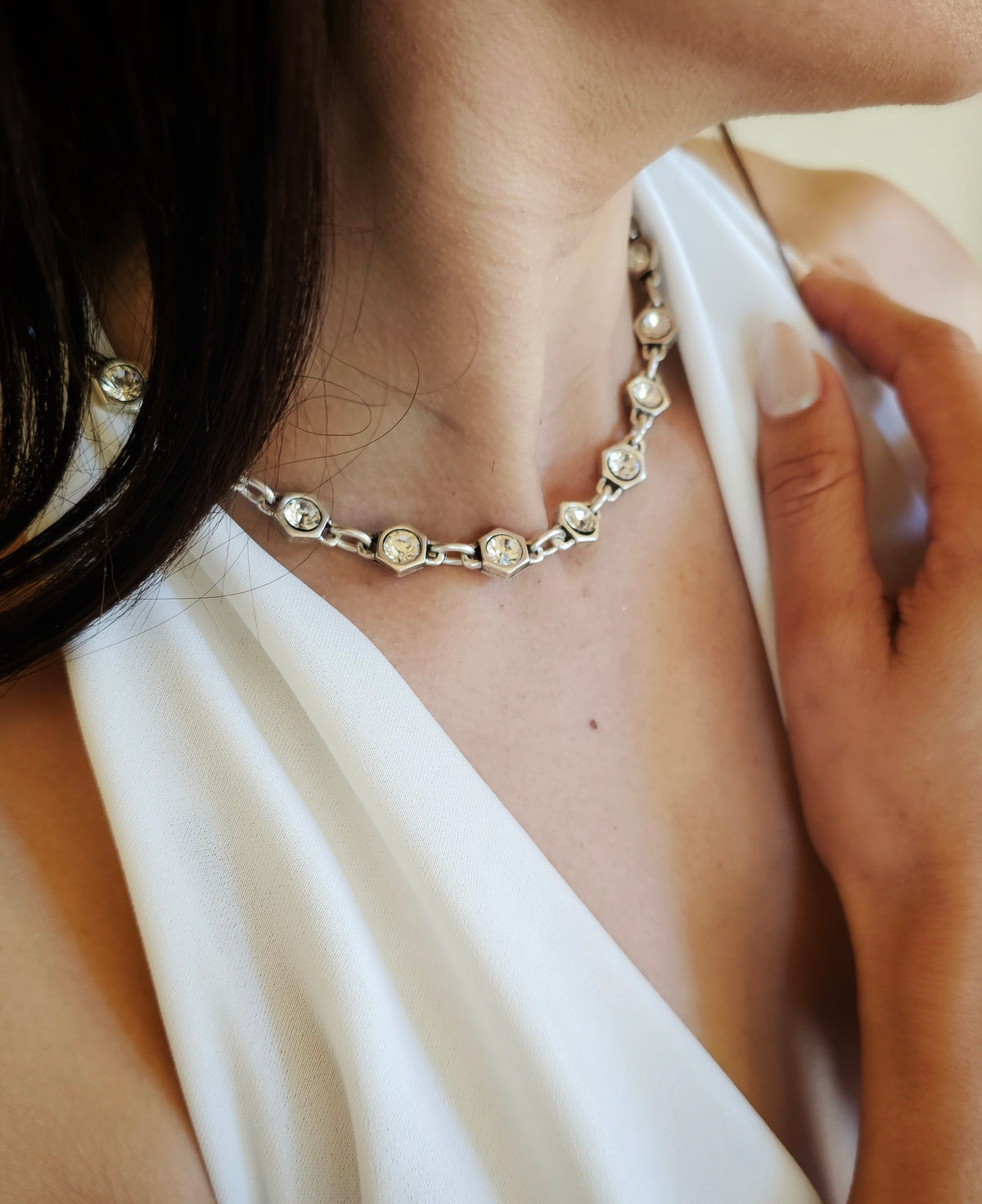 Crystal Perfection Necklace: model wearing a short crystal-link necklace.