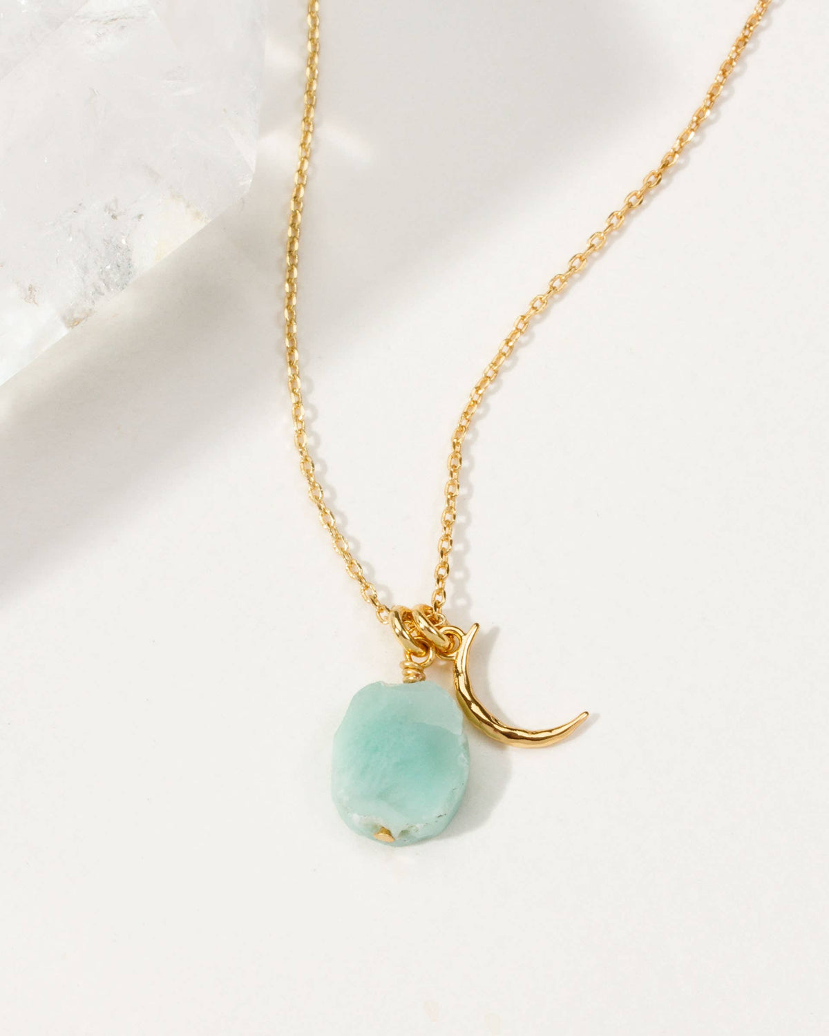 Isla Larimar Necklace: gold-tone necklace with pale aqua pendant and starfish charm.
