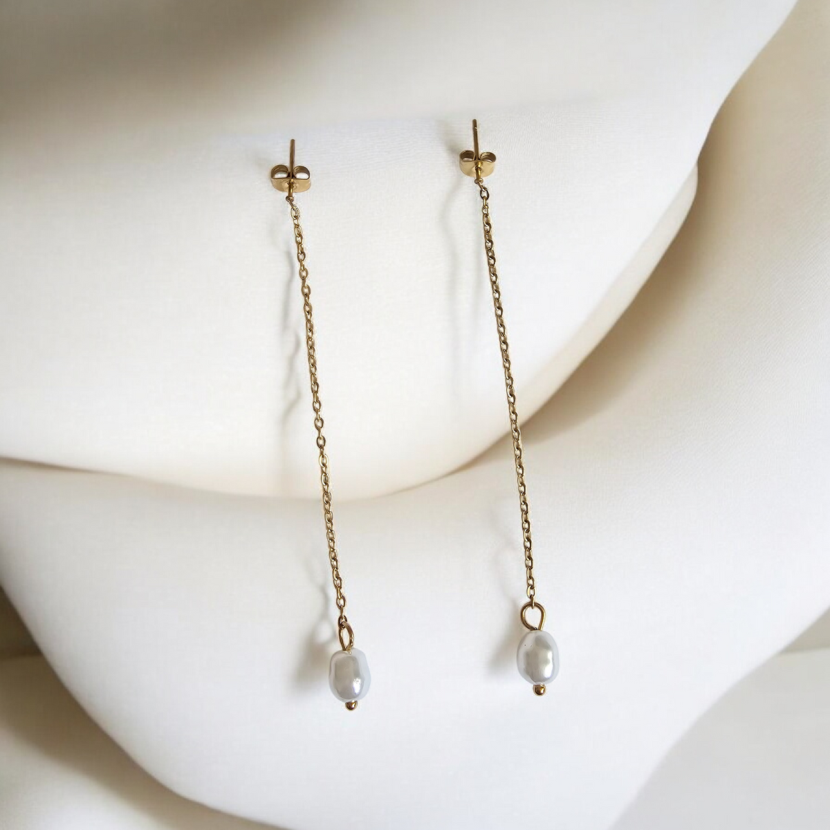 La Perle Line Earrings: long delicate drop earrings with pearl accents.