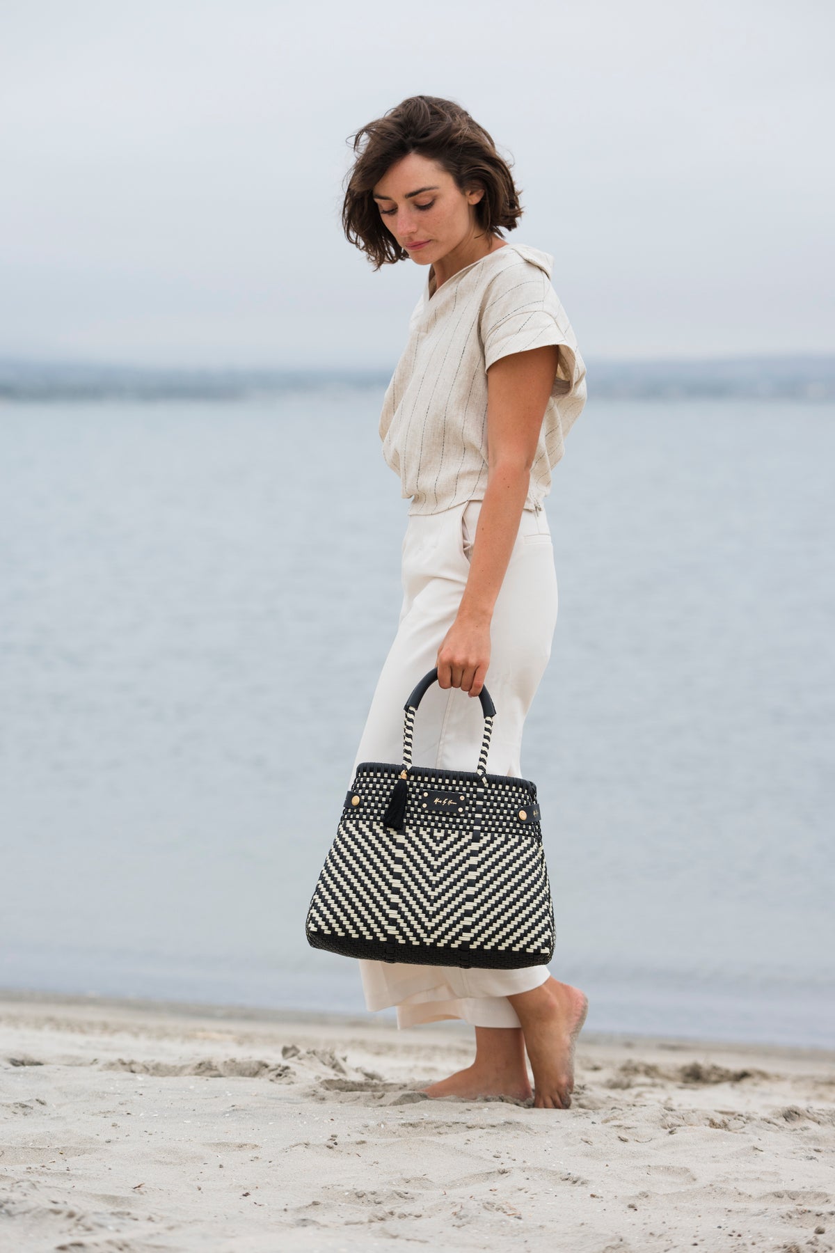 Less Pollution Convertible Handbag – Luxe Ivory Black — handwoven recycled-plastic convertible handbag and tote by Mavis…