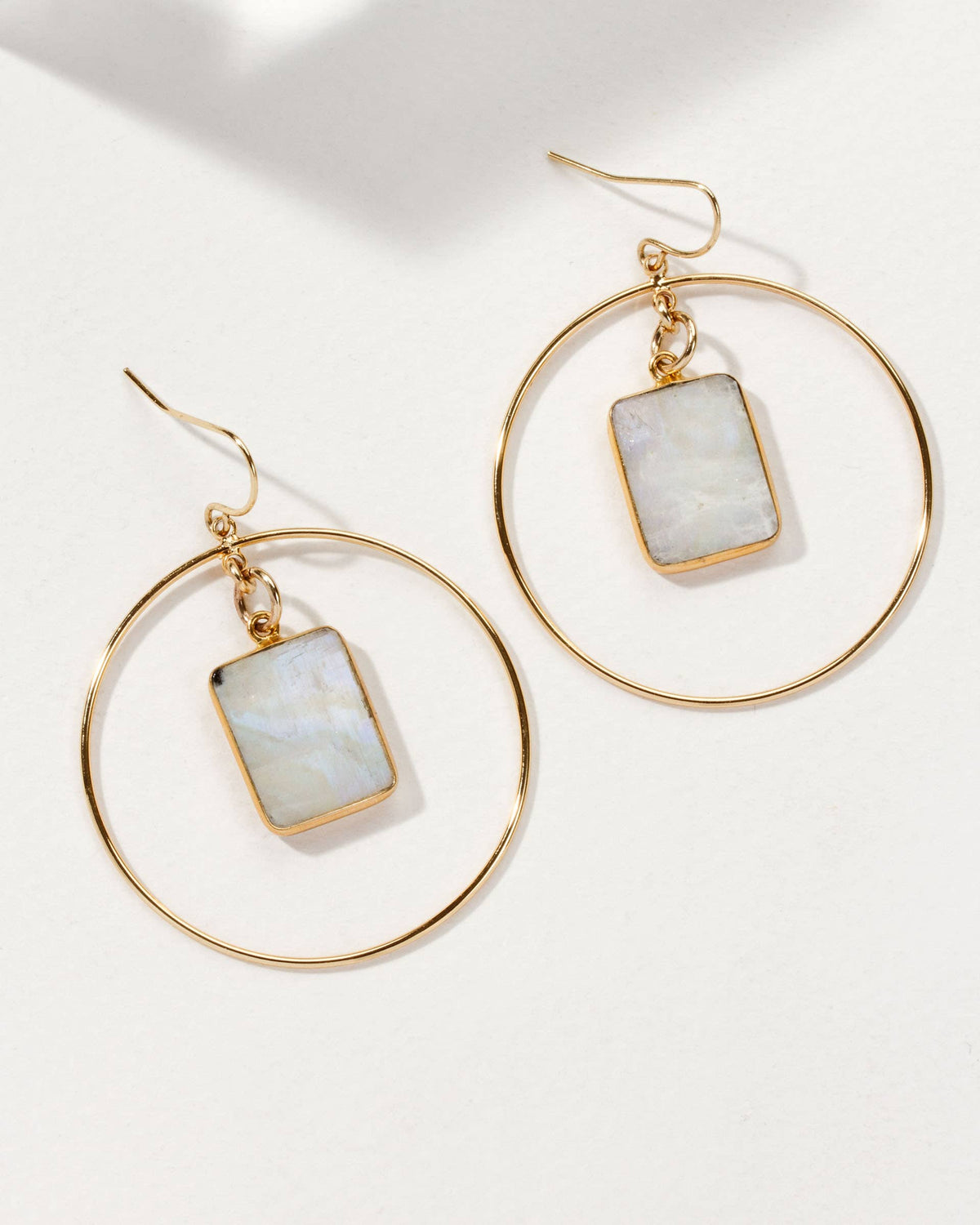 Moonstone Hoop Earrings: gold-tone hoop earrings with rectangular pale stone pendants.