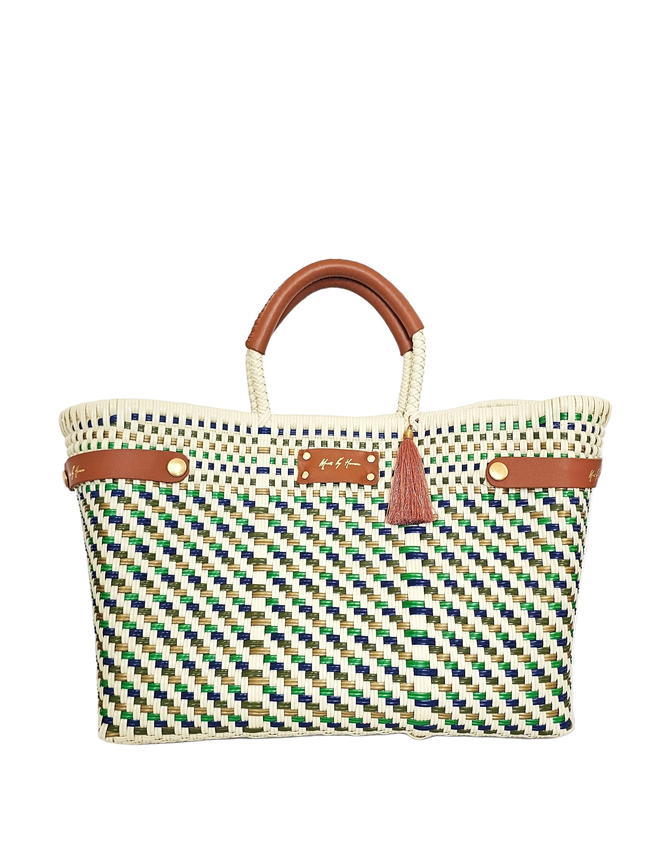 Artisan-handwoven Evergreen Coast sustainable handbag in an ivory, green and blue geometric design