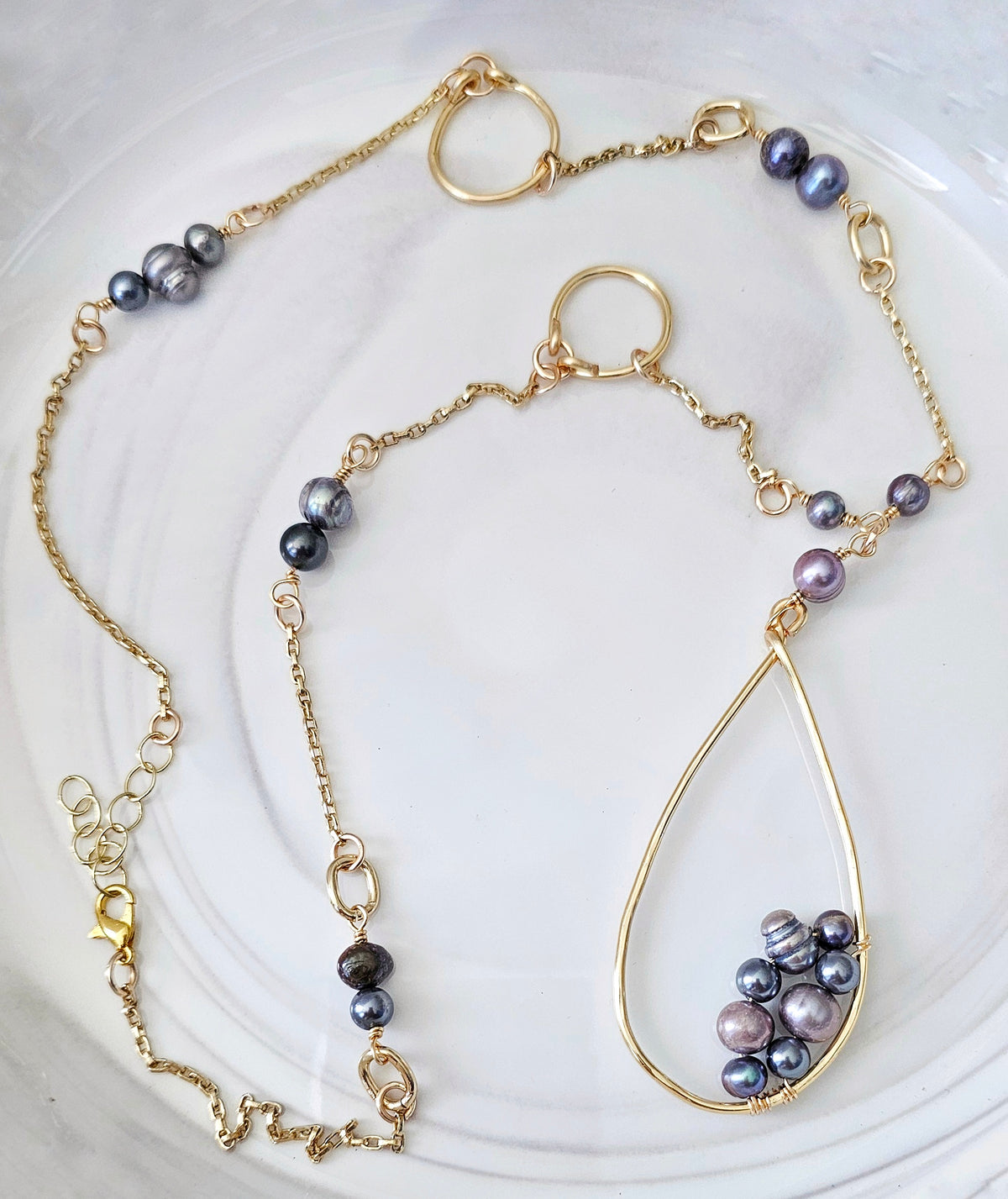 The Ava Baroque Pearl Necklace: long necklace with baroque pearl and bead accents, full view.
