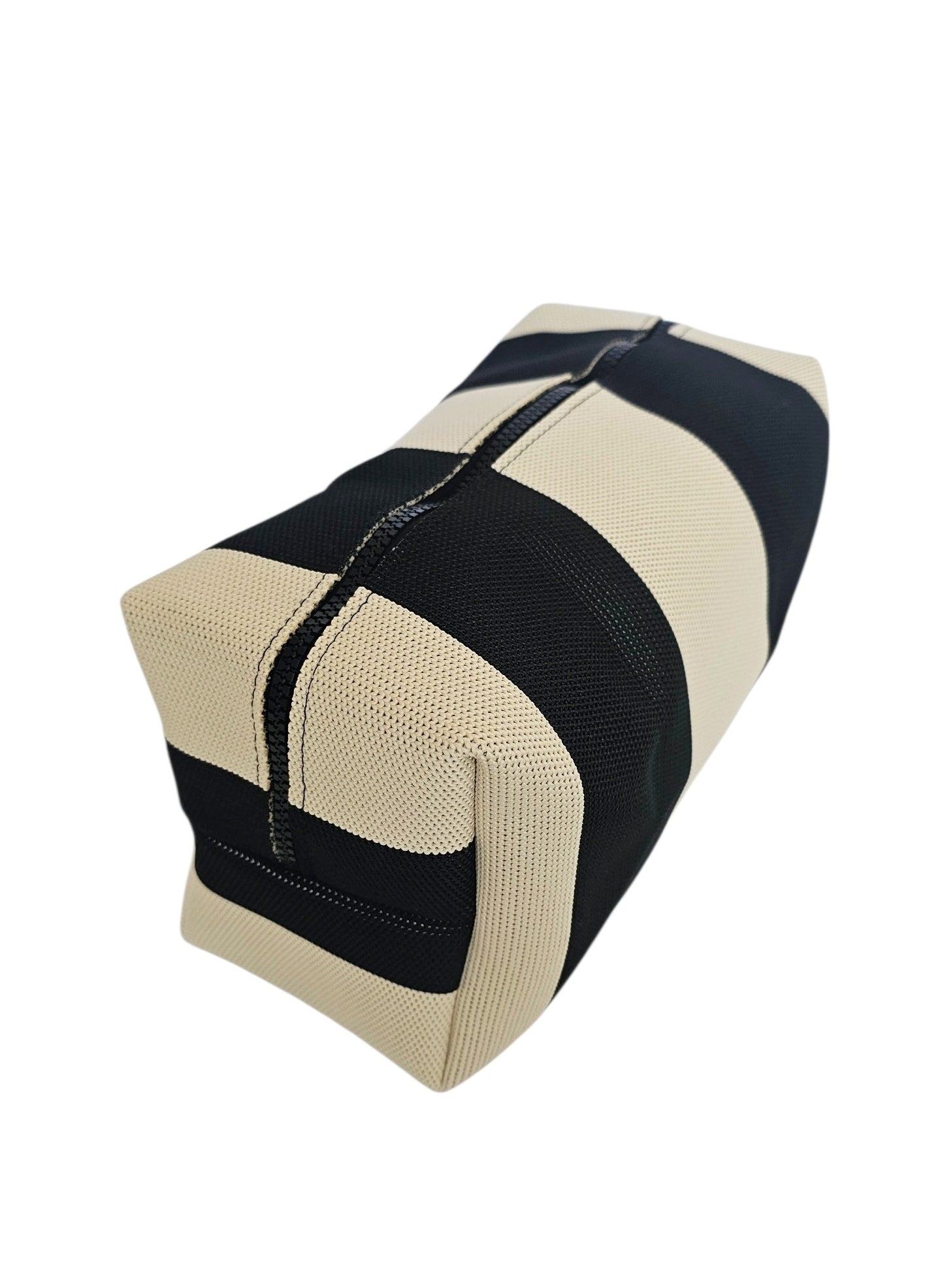 A rectangular zippered pouch or cosmetic bag with alternating wide black and beige textured stripes, shown on a plain white background.