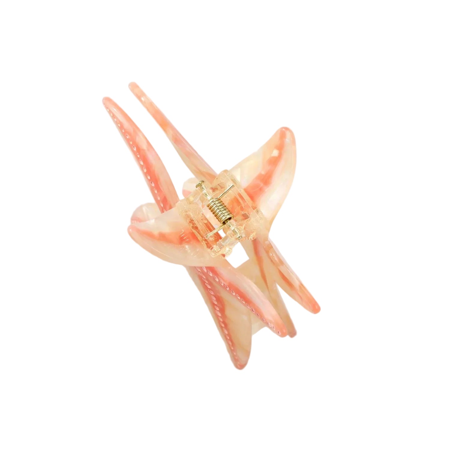 A translucent peach and pink star-shaped hair claw clip with a gold metal spring