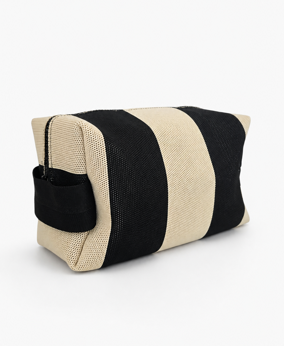 Cabana Pouch in black ivory color. Durable, lightweight zip bag ideal for cosmetics, travel, and daily essentials
