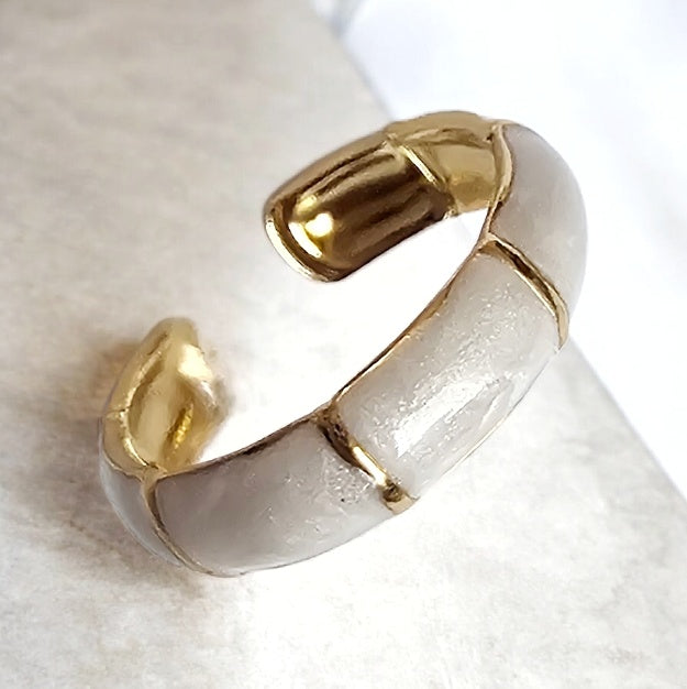 Amoré Enamel Adjustable Ring: white enamel open ring with gold-tone edges, angled view.