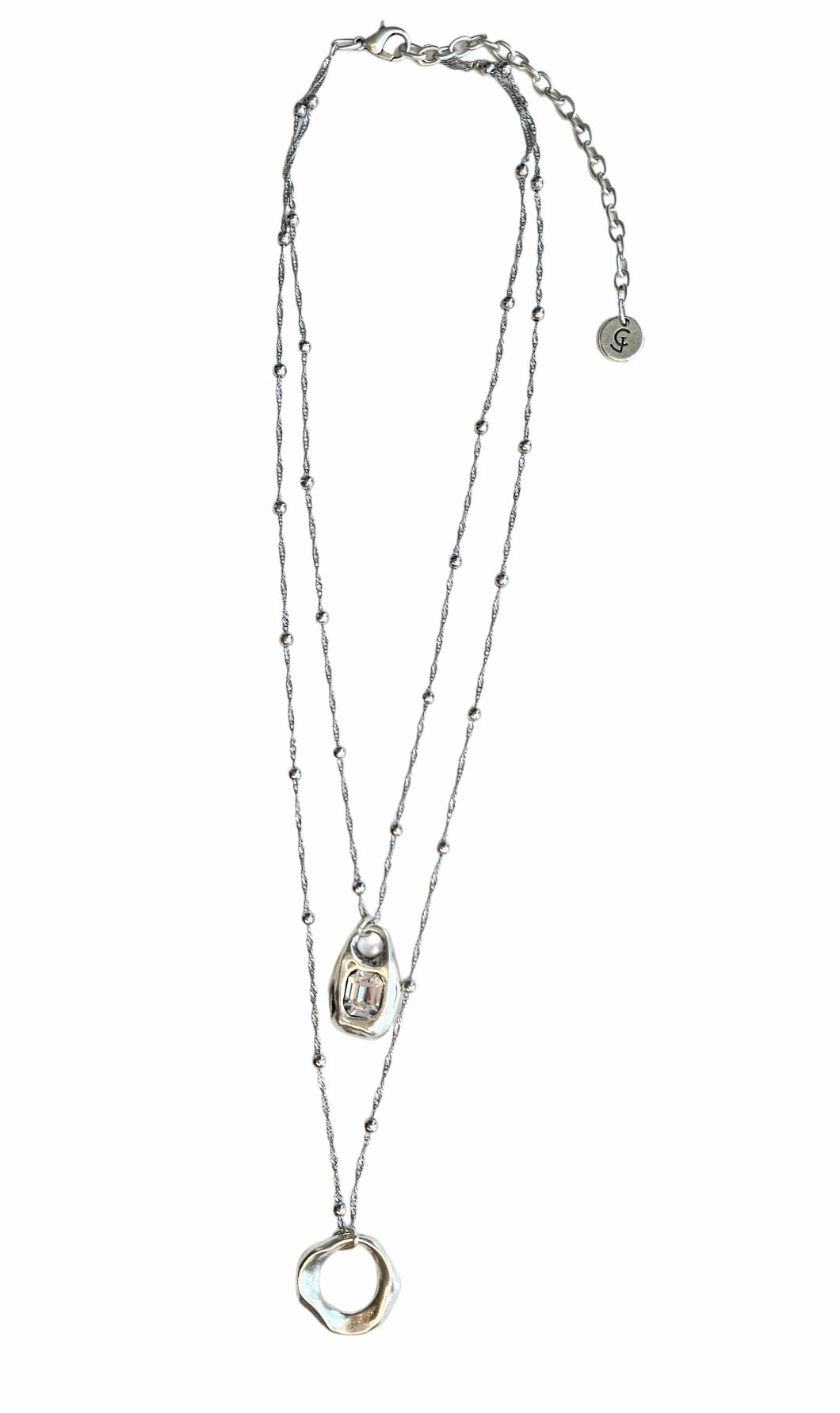 Crystal Aura Necklace: layered silver-tone necklace with crystal pendants, full view.