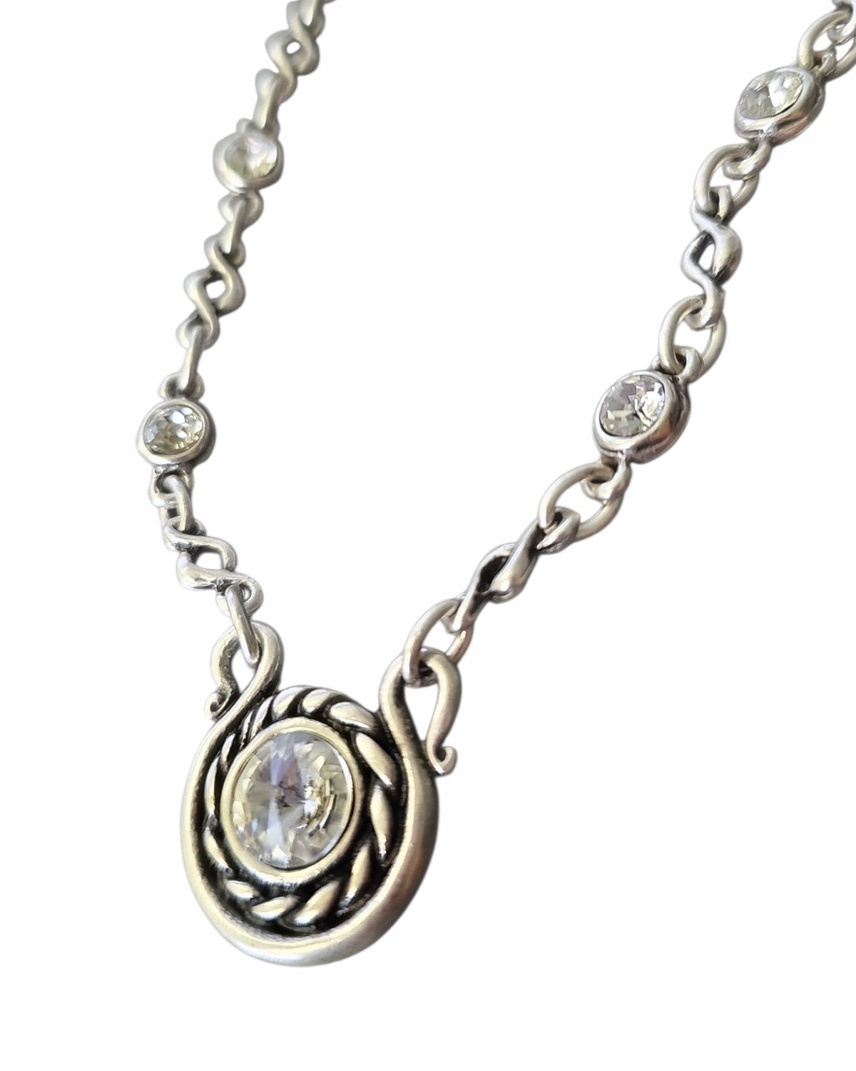 Glimmering Galaxy Necklace: silver-tone link necklace with circular pendant, close-up.