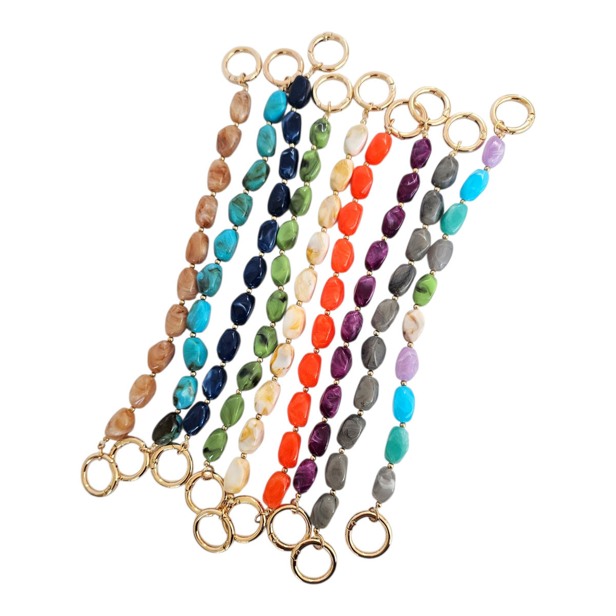 Marbled acrylic chain bag straps displayed in assorted colors, showing available colors.