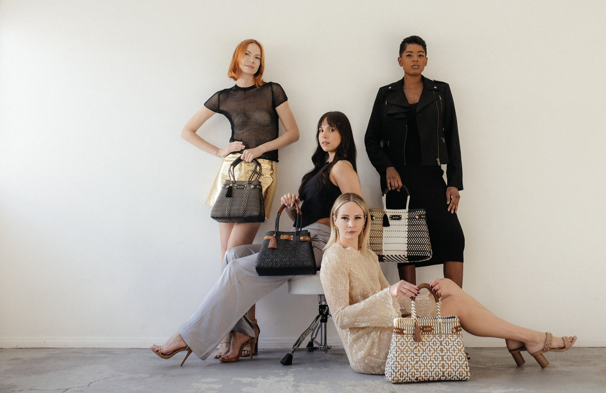MAVIS BY HERRERA Digital Gift Card: models carrying assorted handwoven handbags.