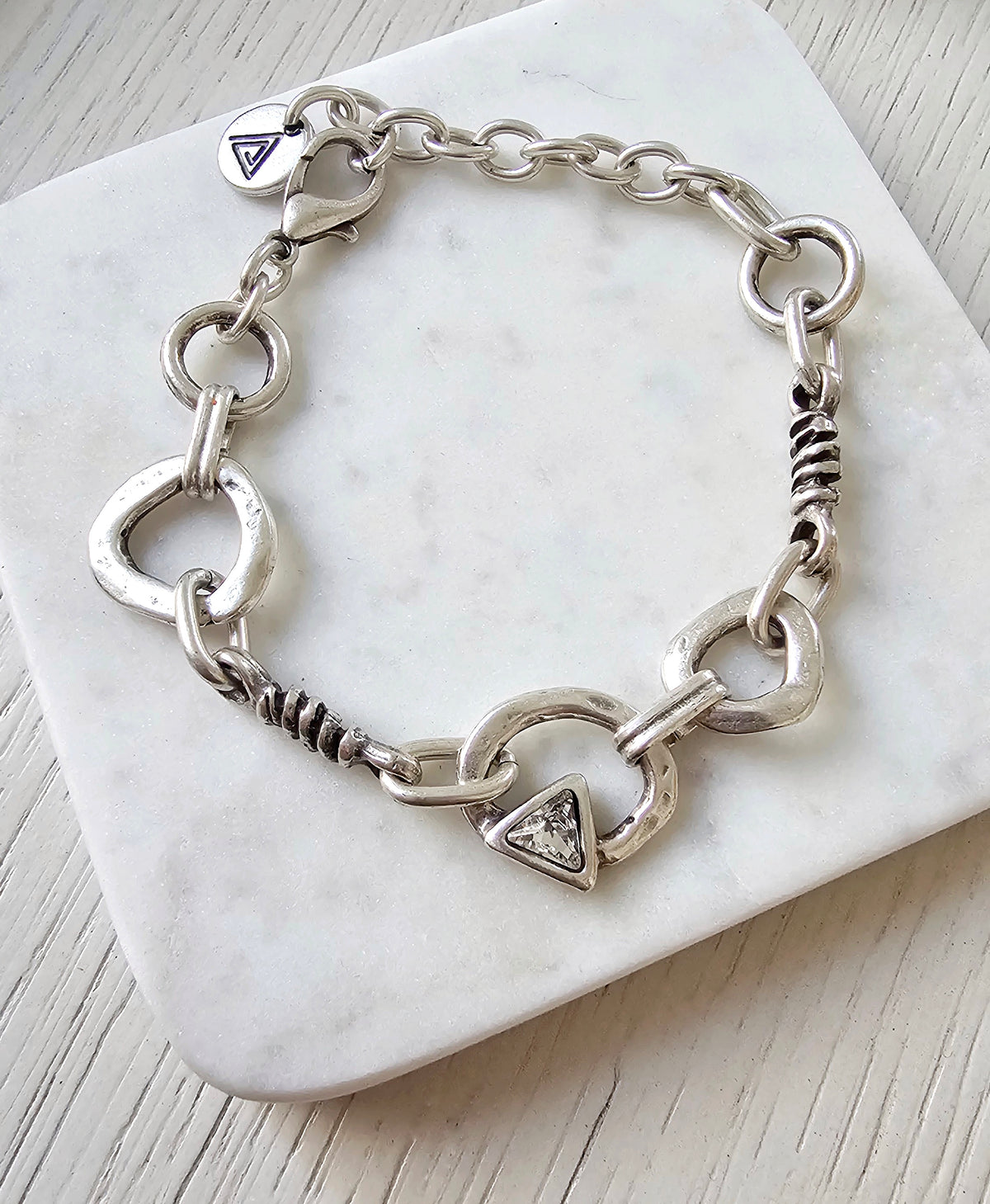 Prisma Bracelet: silver-tone geometric-link bracelet with toggle closure.