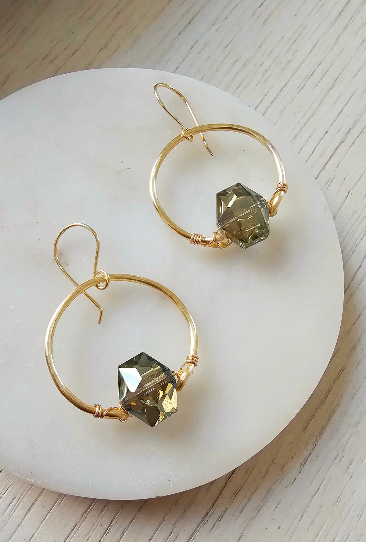 The Crystalline Earrings: hoop earrings with faceted crystal pendants, full pair.