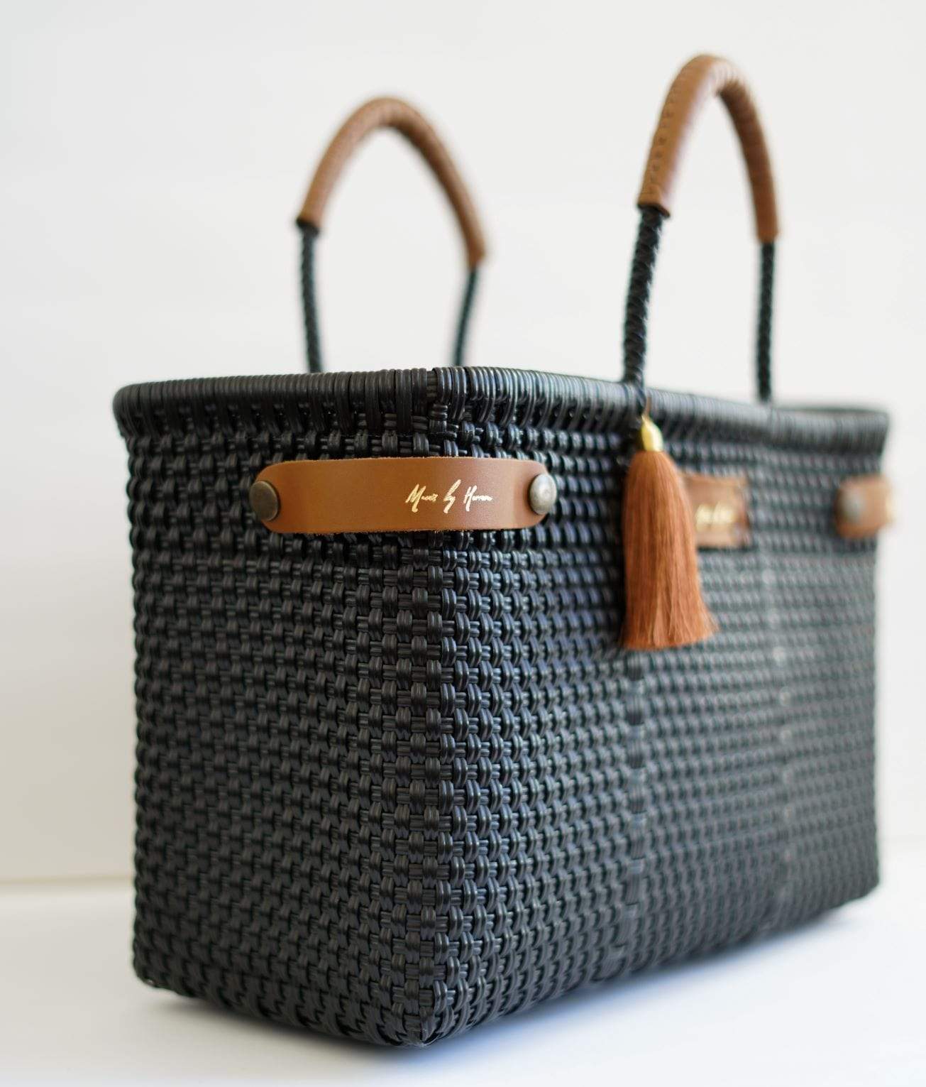 Black Less Pollution convertible handbag expanded into a spacious tote